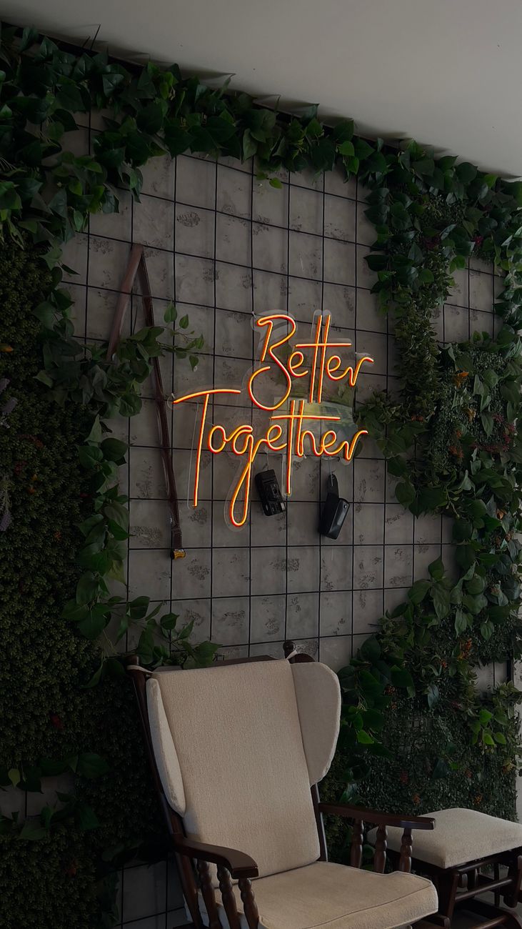 better together text on wall over armchair